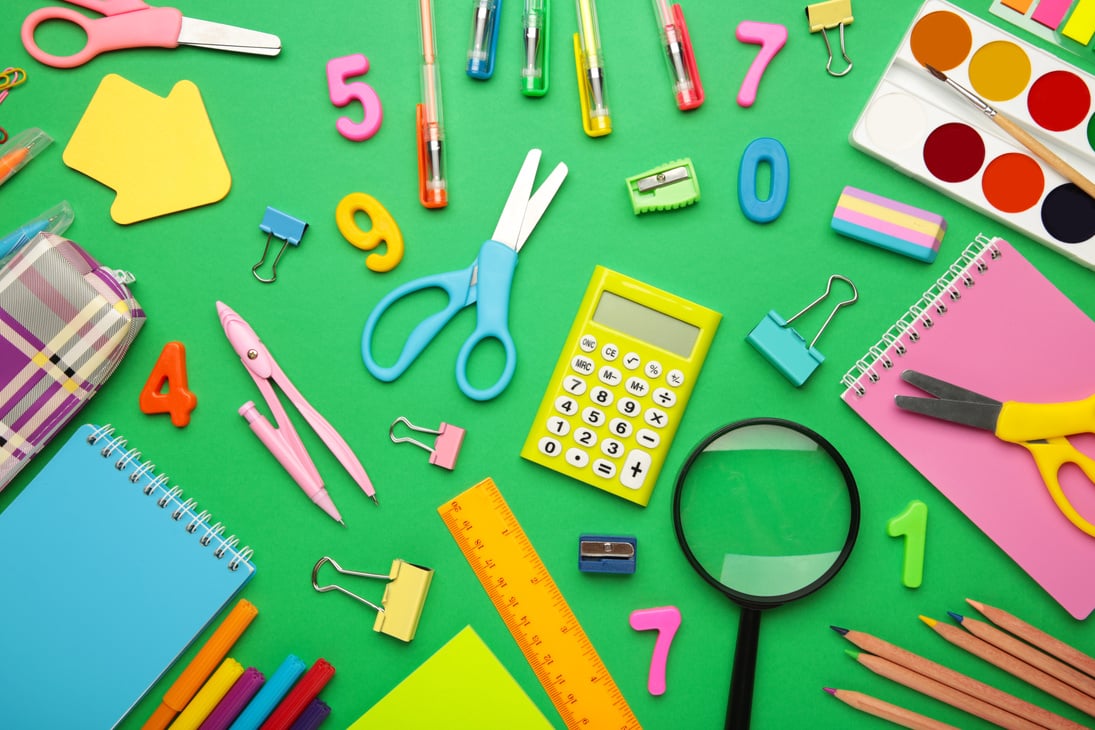 School Supplies on Green Background. Back to School Concept.